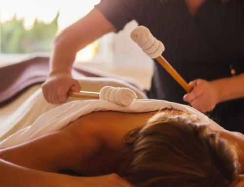 Woman enjoying a percussion massage at The Sanderling Hotel's spa